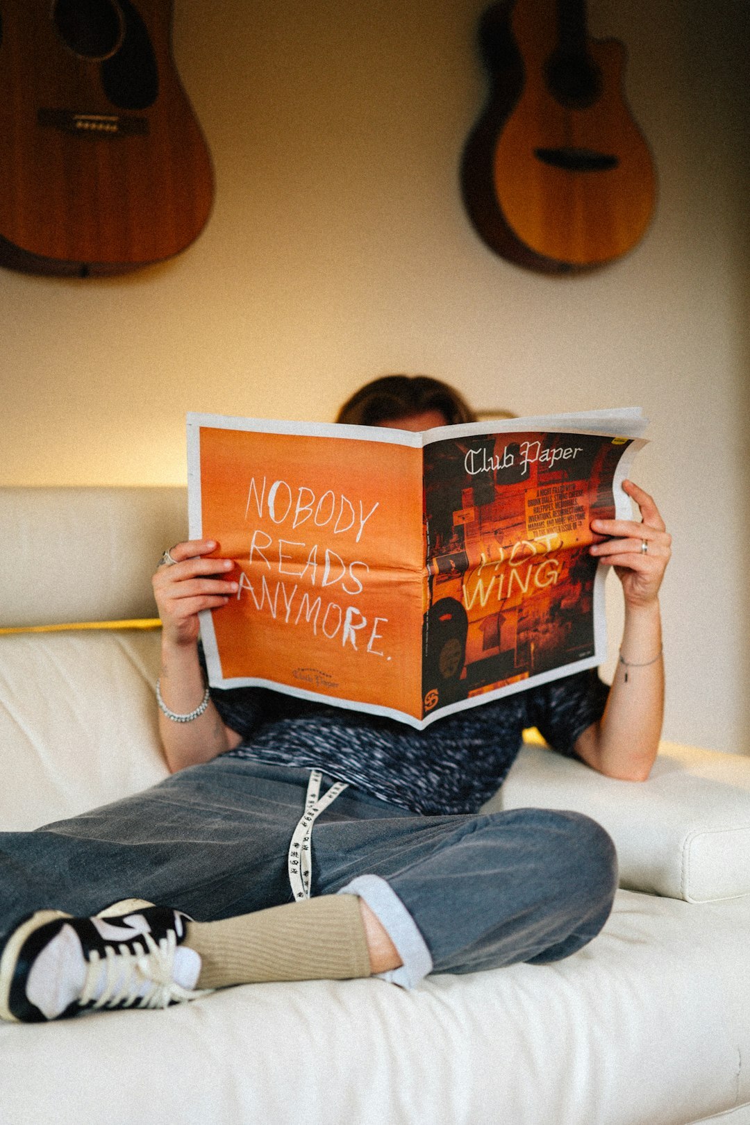 person reading old book at home